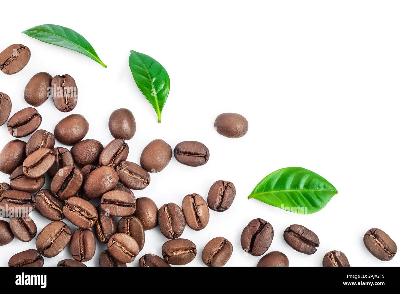 Heap of roasted coffee beans with leaves isolated on white background ...