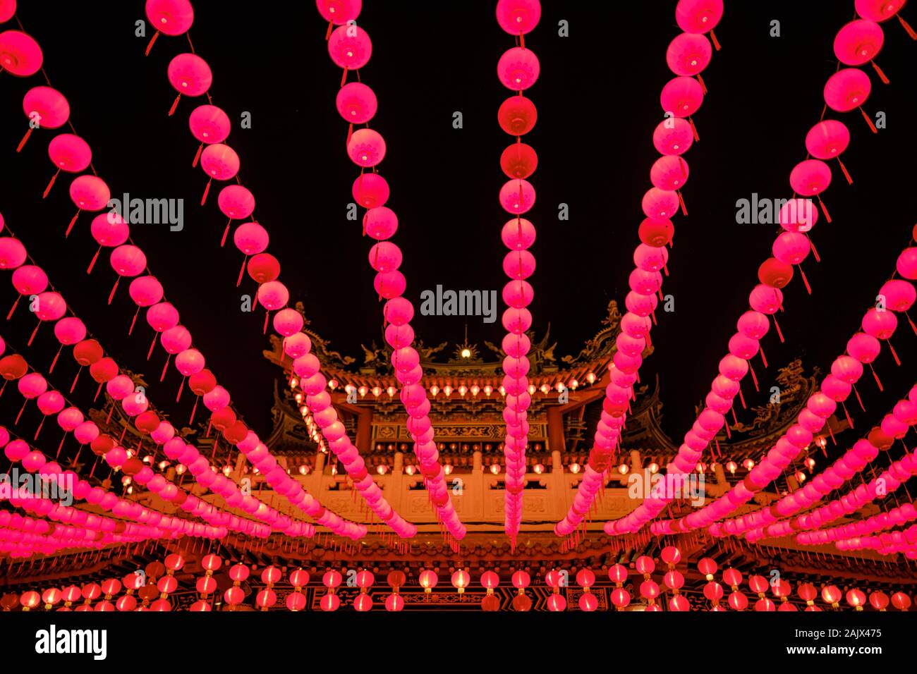 Red lanterns hanging in rows during chinese lunar new year in the night at Thean Hou Temple, Kuala Lumpur, Malaysia Stock Photo