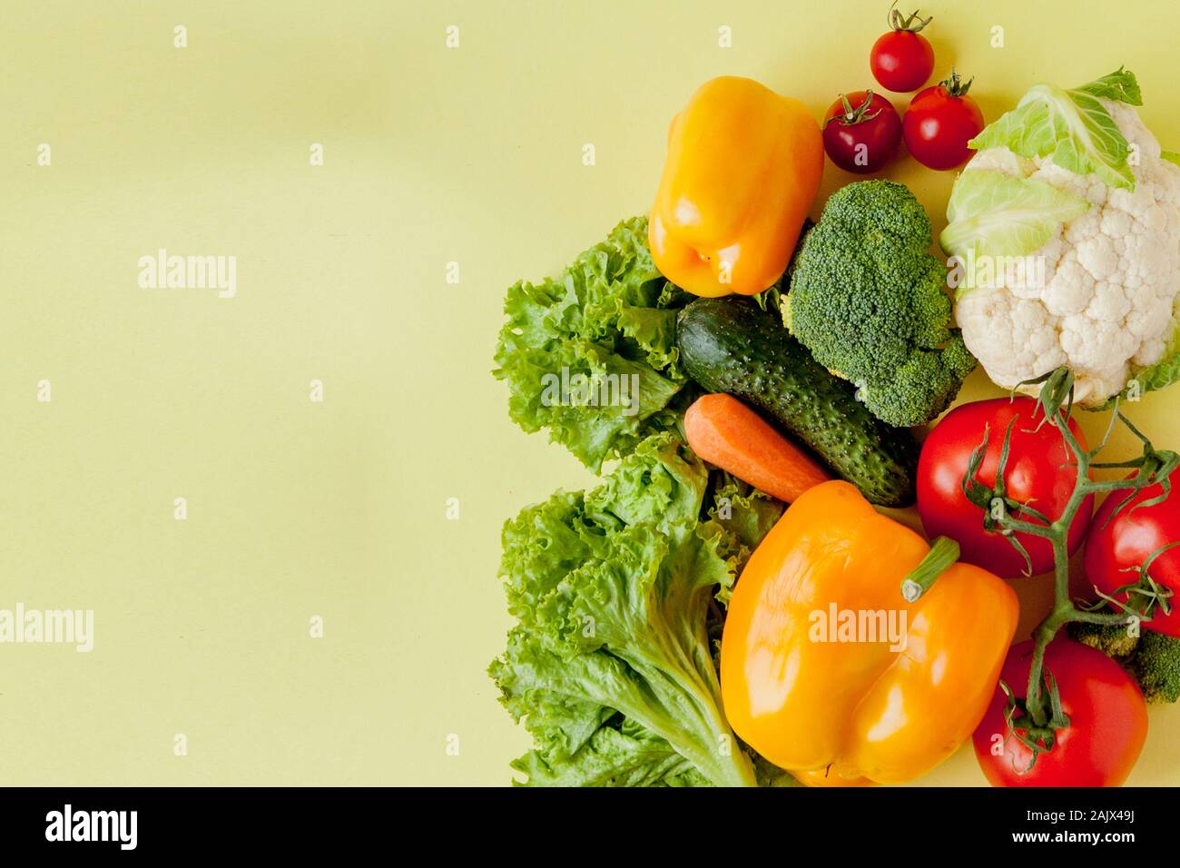 Organic vegetables broccoli cucumbers bell peppers apples in brown