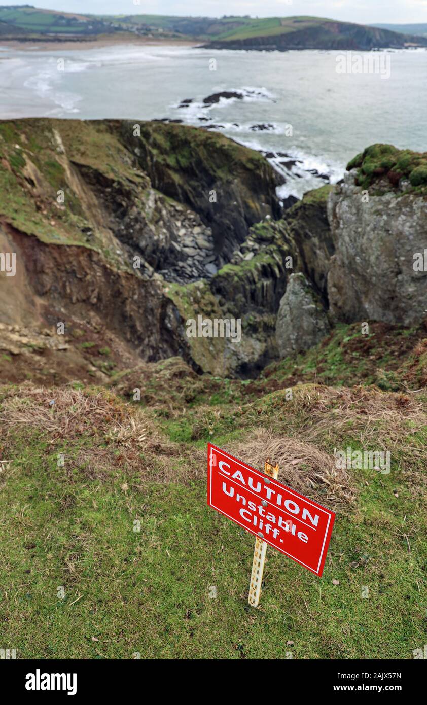 Caution, Unstable Cliffs sign on Burgh Island in Devon. Looking towards ...