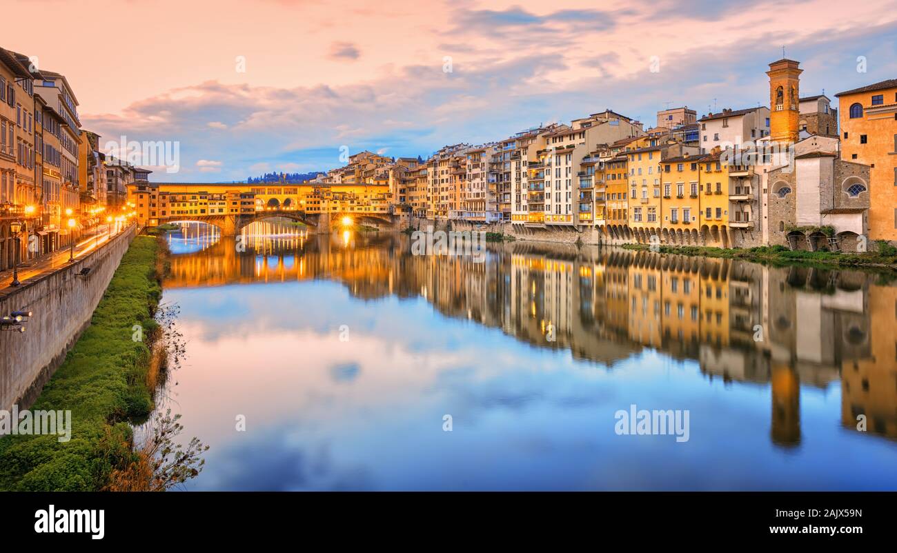 Arno river with Ponte Vecchio bridge in the Old town of Florence, Tuscany, Italy, in sunrise light Stock Photo