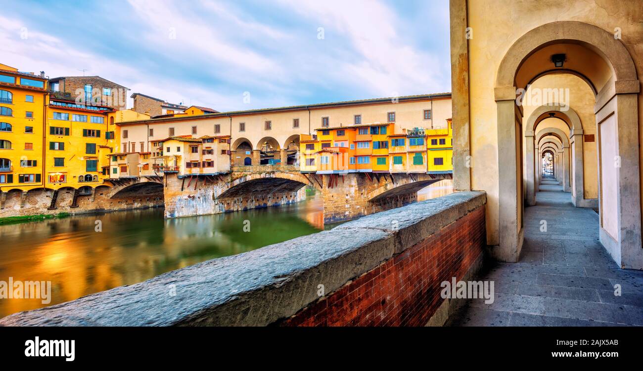 Ponte Vecchio historical bridge and the riverside promenade gallery in the Old town of Florence, Tuscany, Italy Stock Photo