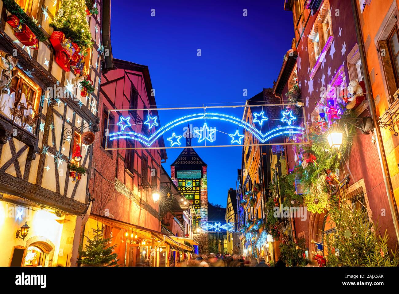 Festive Christmas illumination in the historical Old town of Riquewihr, Alsace, France Stock Photo