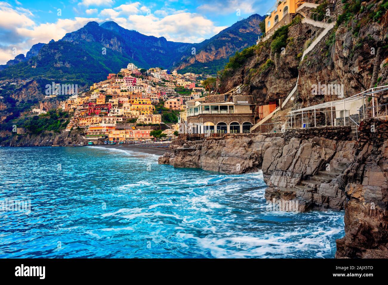 Positano, a cliffside village on Amalfi coast, Naples, Italy, dramatically set between rocks on Mediterranean sea Stock Photo