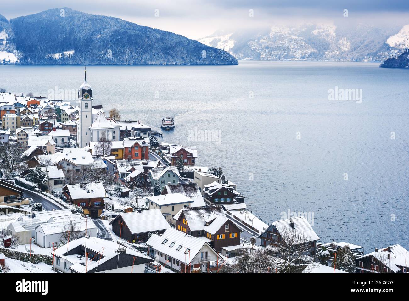 Lake Lucerne, Switzerland, view of Beckenried village and Alps mountains covered with white snow at winter timer Stock Photo