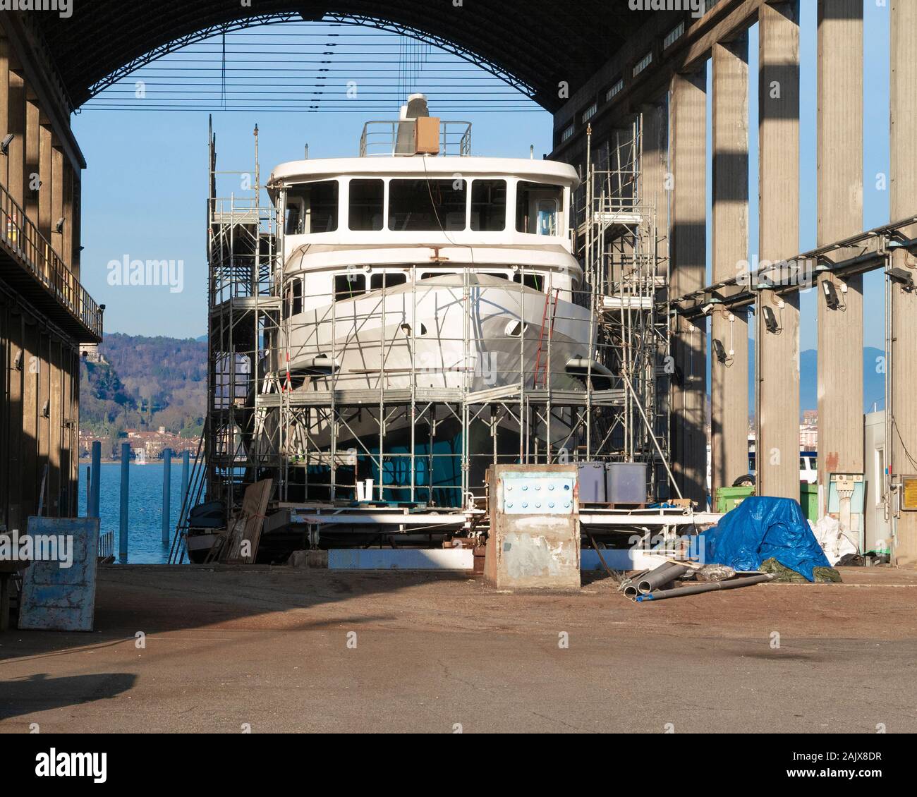 maintenance to the hull of a boat wrapped by high scaffolding in a shipyard Stock Photo Alamy
