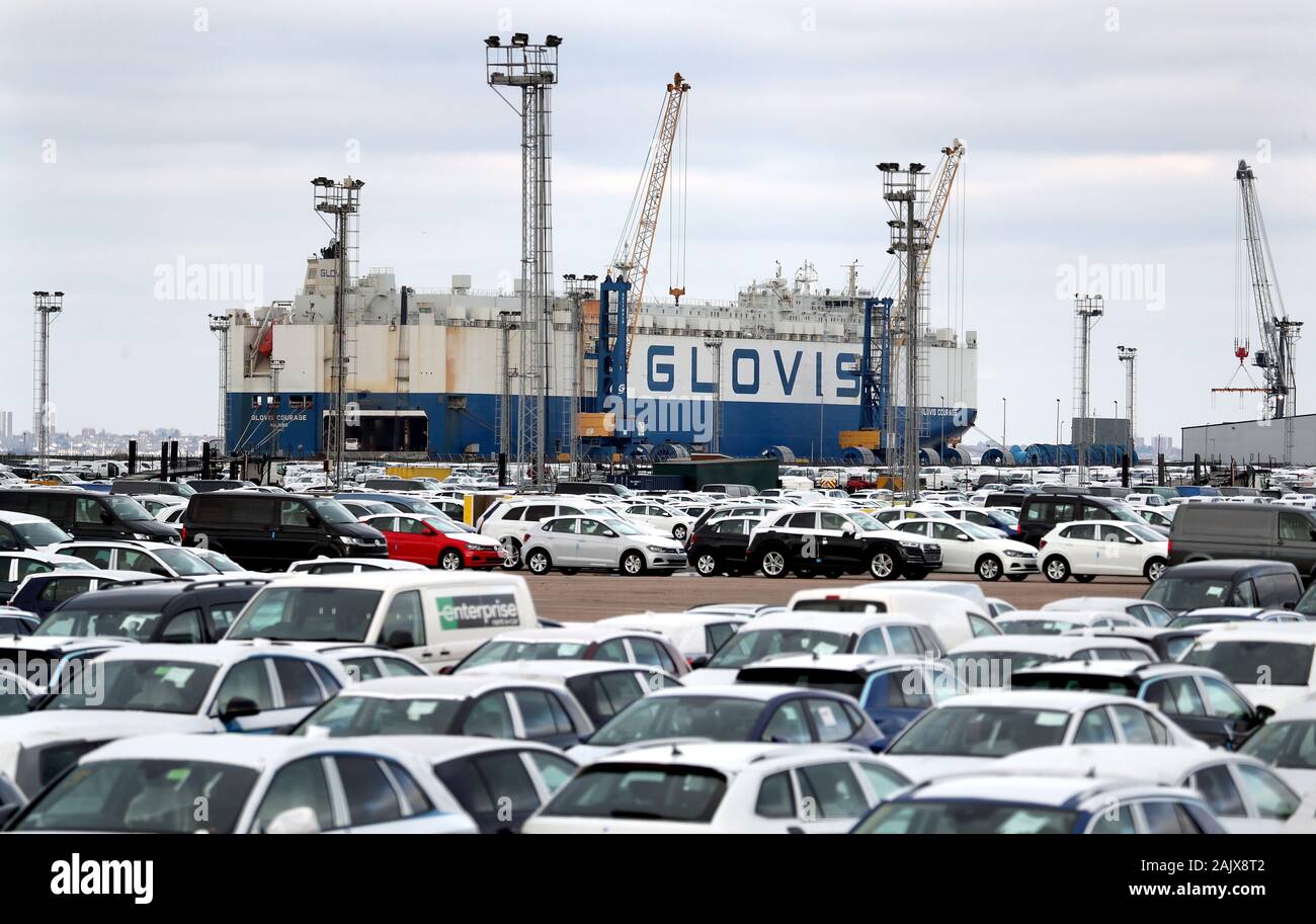 A car carrying ship delivers new cars to a compound near Sheerness in Kent. New car sales sunk to a six-year low in 2019 due to low consumer confidence and uncertainty over the treatment of diesel vehicles, the automotive industry has said. Stock Photo