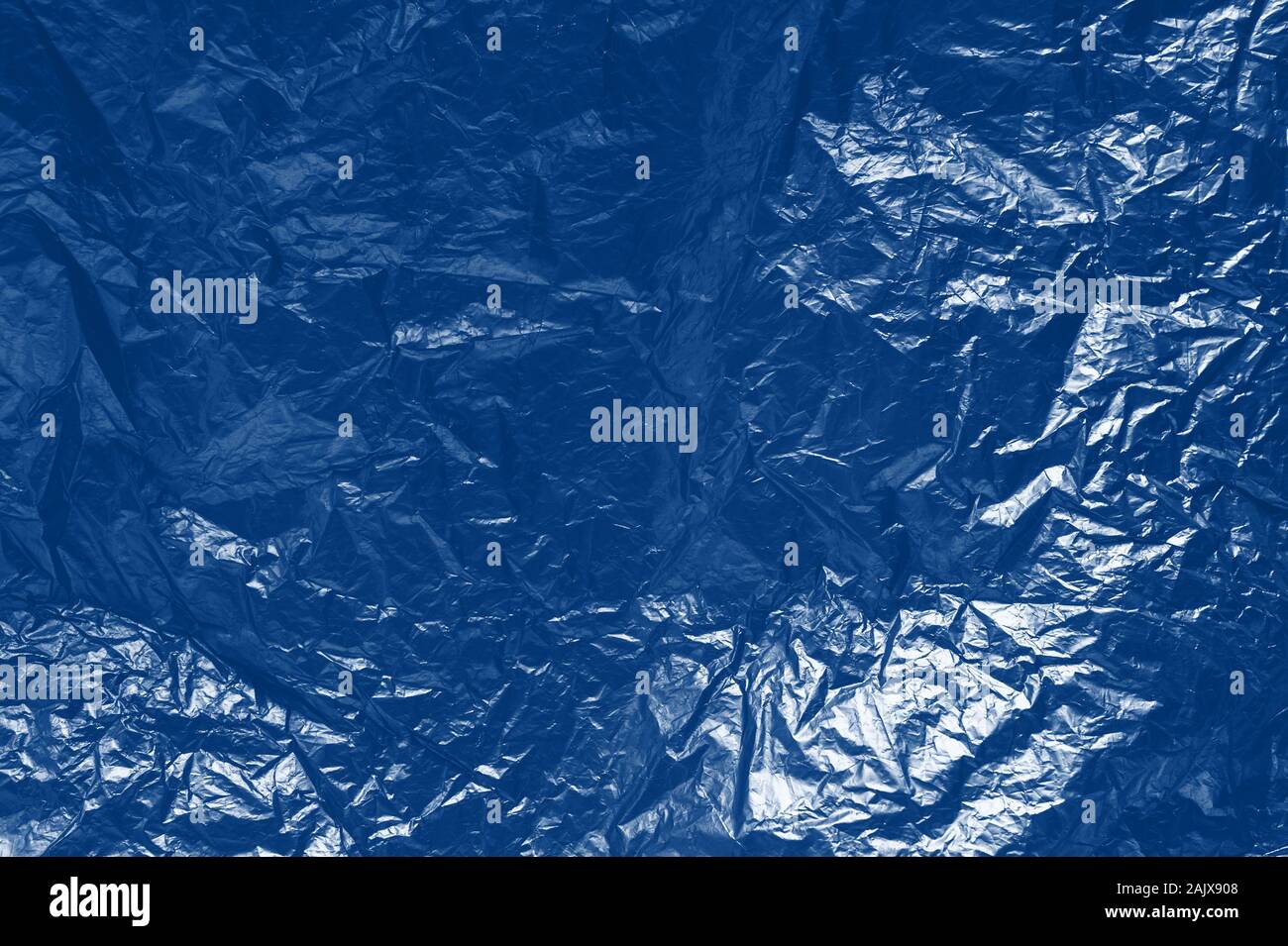 background of crumpled paper. Classic blue toning trend 2020 year color Stock Photo