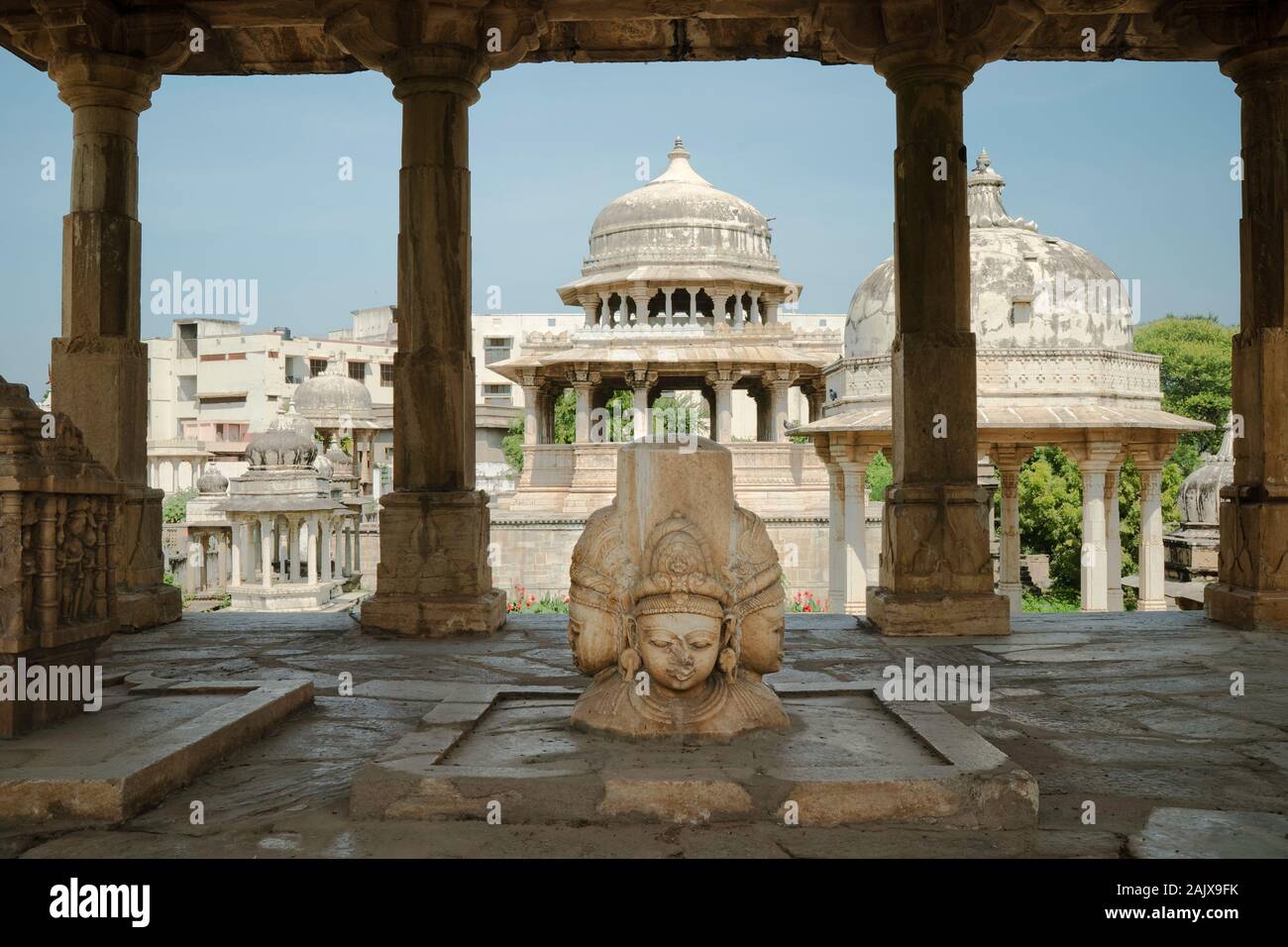 Sculpture of Hindu tripartite Gods under Royal cenotaph and surrounded by many cenotaphs in Udaipur, Rajasthan, India. Stock Photo