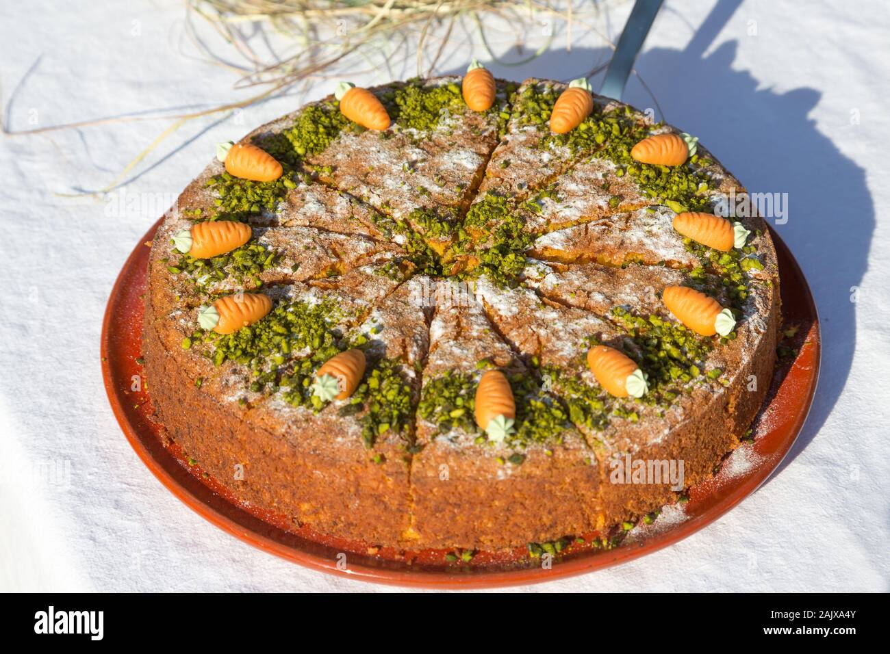 carrot cake on a table with white tablecloth Stock Photo