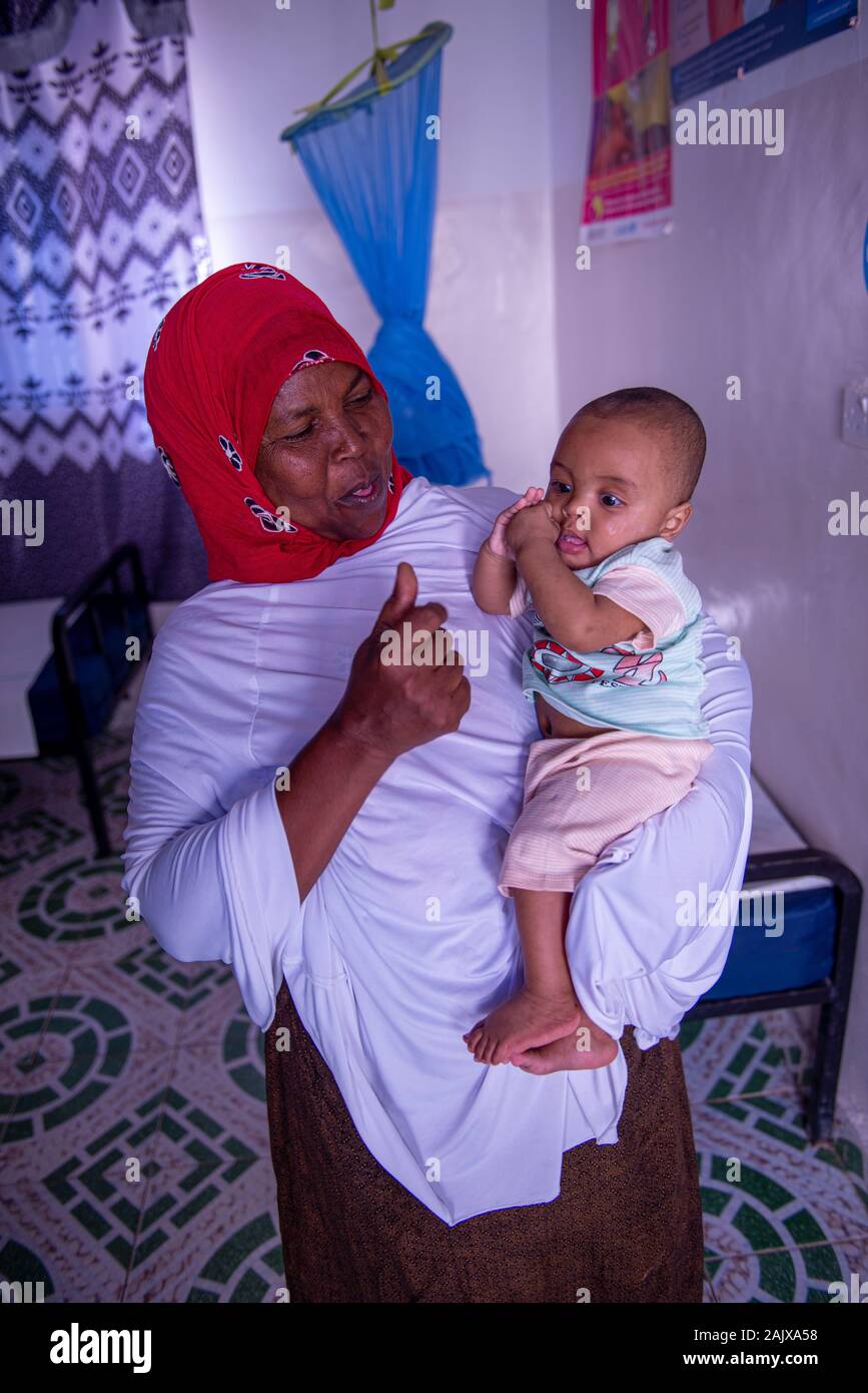 Midwife and baby in Gibiley, Somaliland Stock Photo
