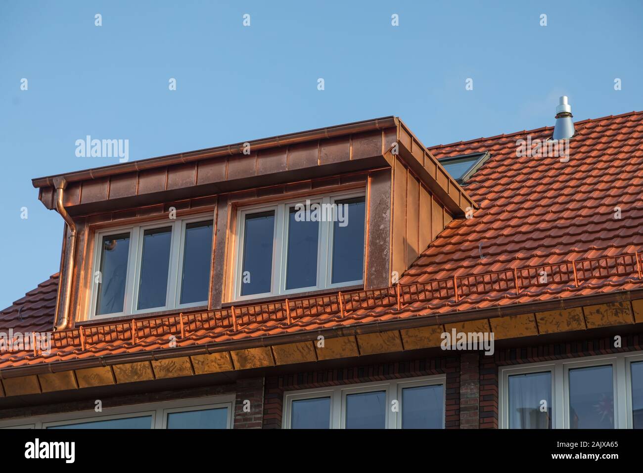 large copper dormer on rooftop Stock Photo