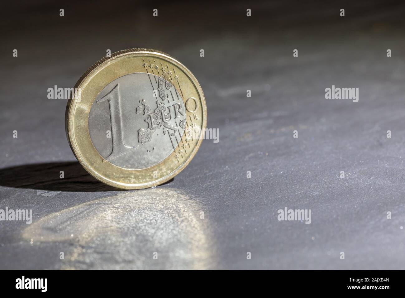one Euro coin with gray background Stock Photo - Alamy