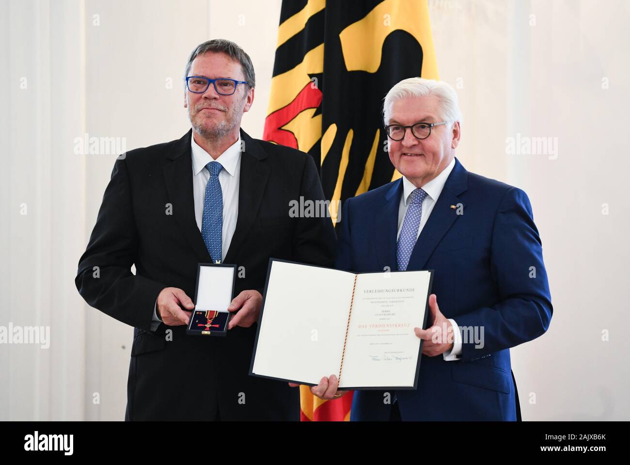 Berlin, Deutschland. 04th Dec, 2019. Federal President Frank-Walter STEINMEIER presents the Order of Merit to Claus KAPELKE (Darmstadt) Awarding the Order of Merit of the Federal Republic of Germany under the motto 'Commitment Forms' at Bellevue Palace in Berlin, Germany on December 4th, 2019. Â | usage worldwide Credit: dpa/Alamy Live News Stock Photo