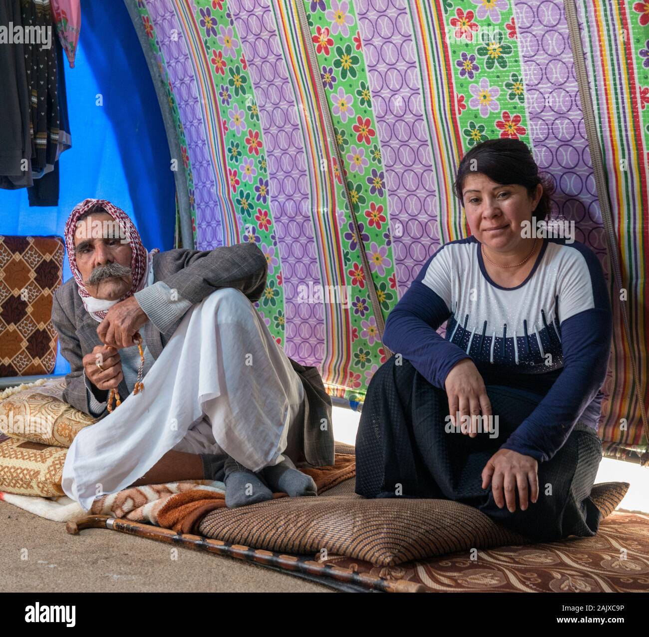 Family in their tent in the Essyan IDP camp, ,northern Iraq Stock Photo