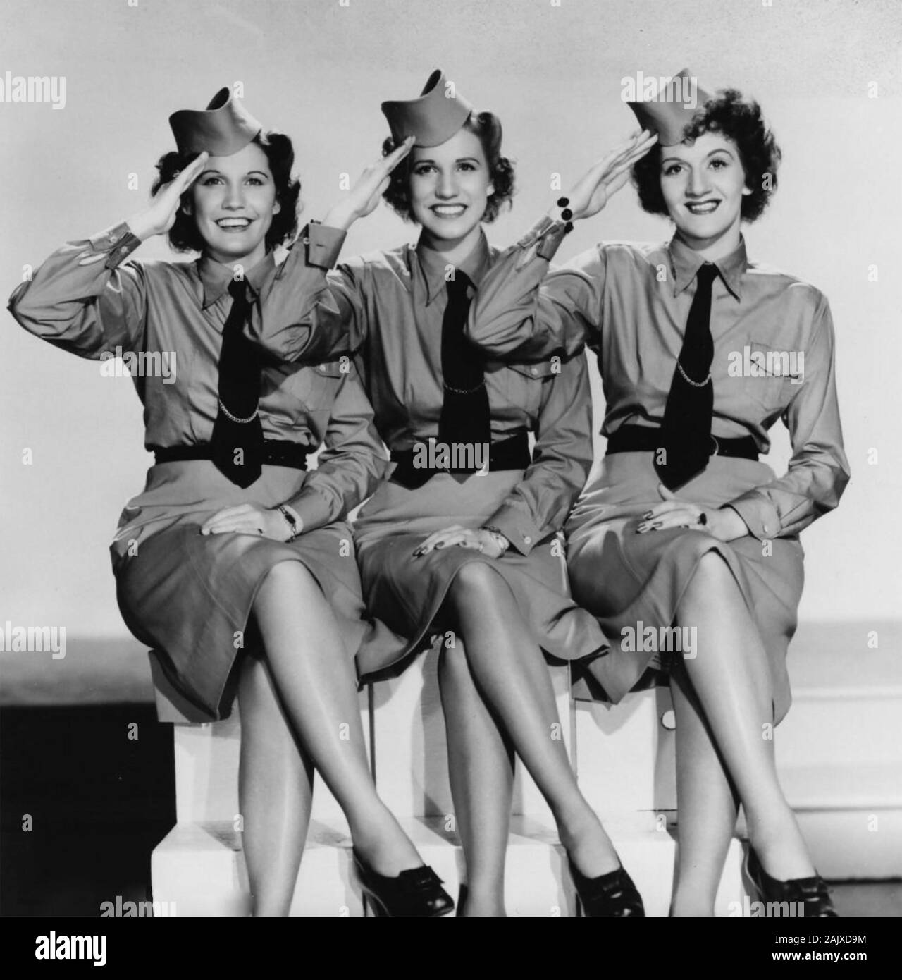 ANDREWS SISTERS Promotional photo of American vocal group about 1944. From left: Maxene,Patti, LaVerne. Stock Photo