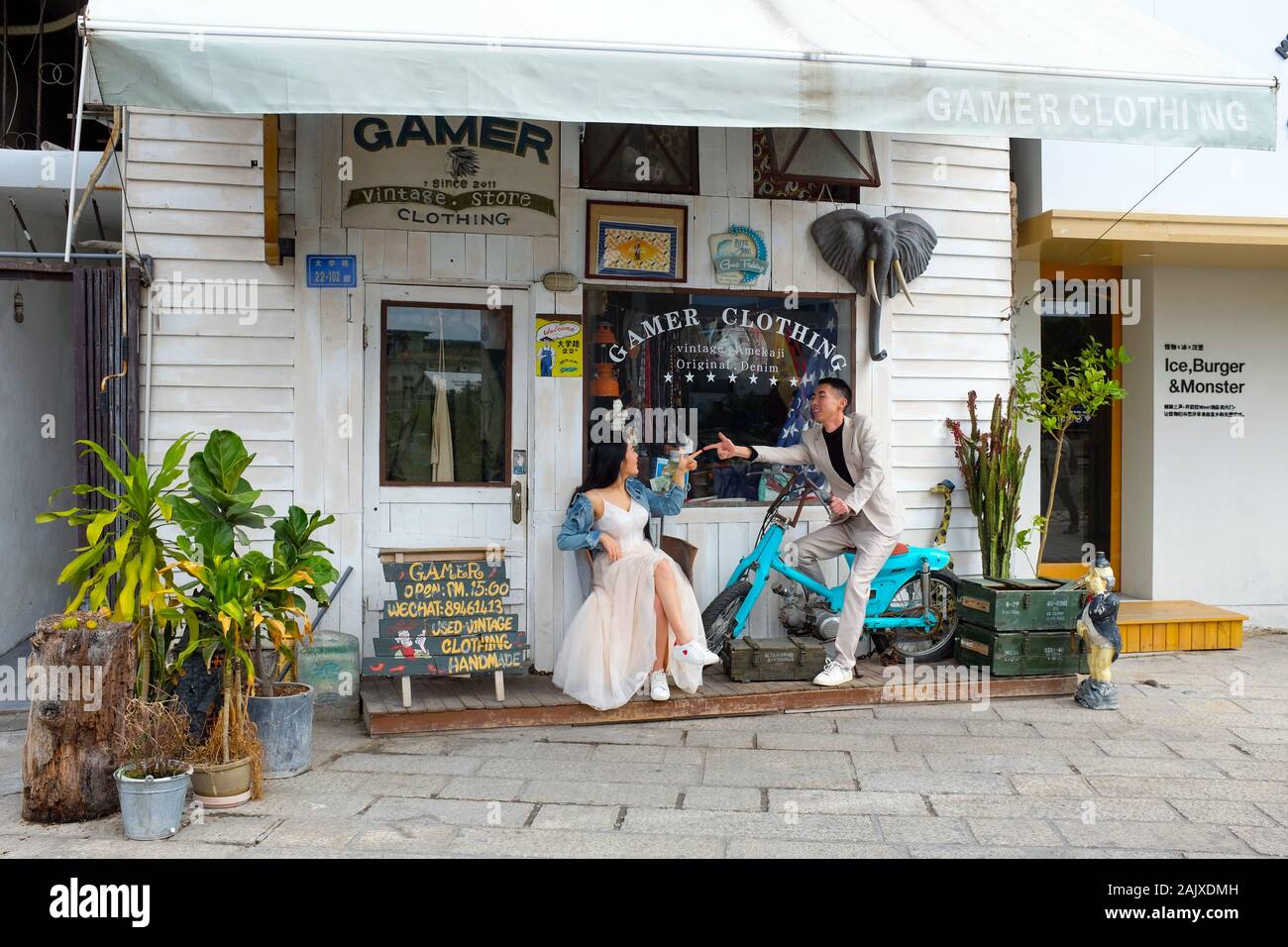 A couple taking part in a wedding shoot in Shapowei, Xiamen (Amoy), China. Stock Photo