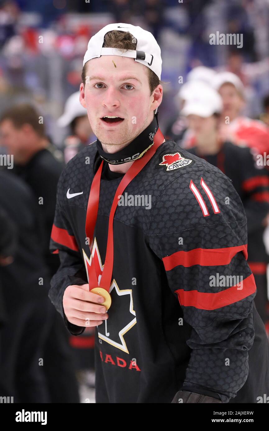 Happy Canadian player Alexis Lafreniere poses with gold medal after his team won the 2020 IIHF World Junior Ice Hockey Championships, as they won the Stock Photo