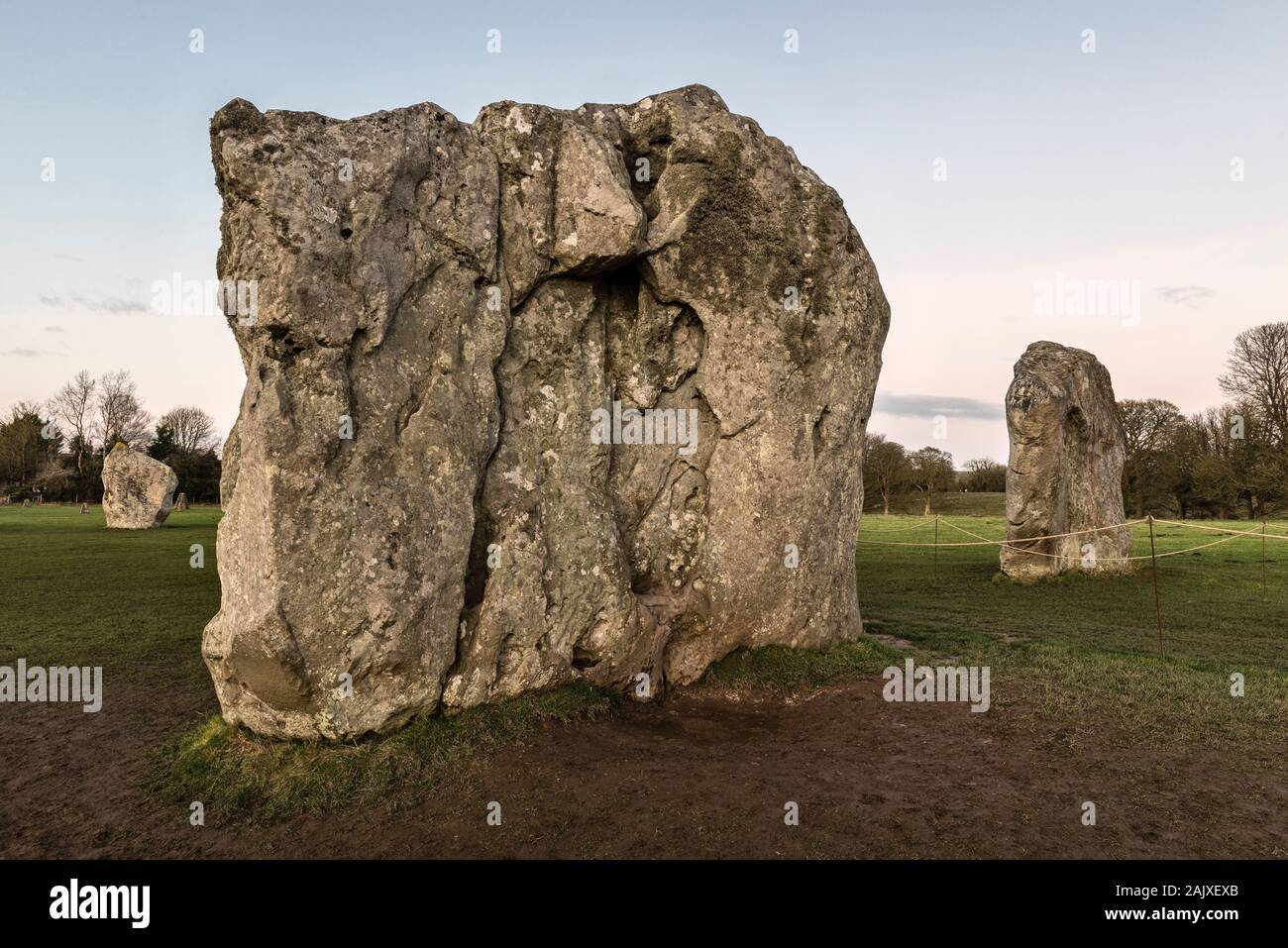 Avebury, Wiltshire, a vast Neolithic henge monument built around 3000 BC. The two portal stones marking the entrance, and part of the inner circle Stock Photo