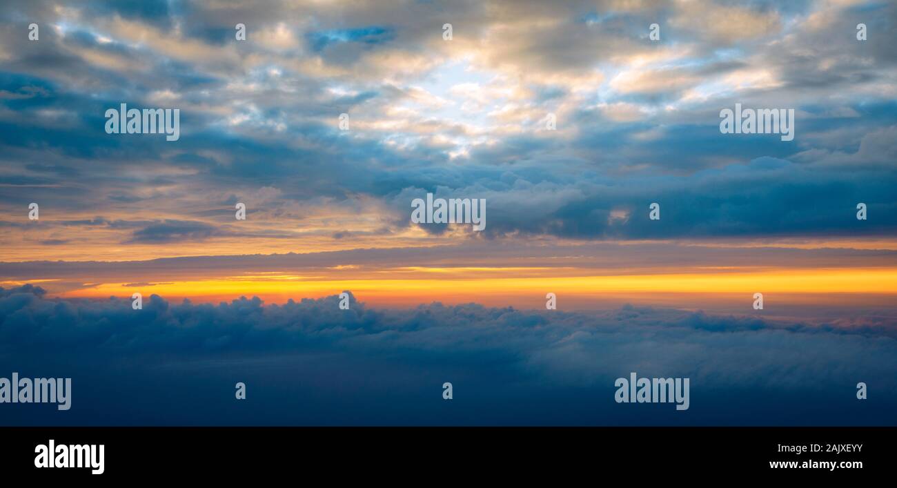 Blanket of clouds. Sun going below a blanket of clouds. On top of a