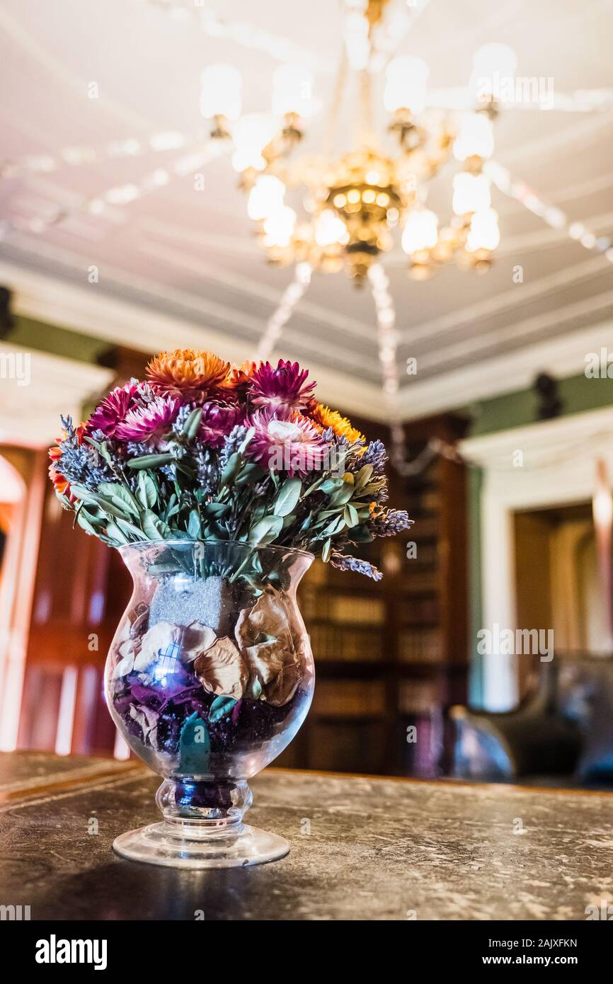 Vase of dried flowers on a writing desk in the library of Hughendon Manor  Stock Photo - Alamy