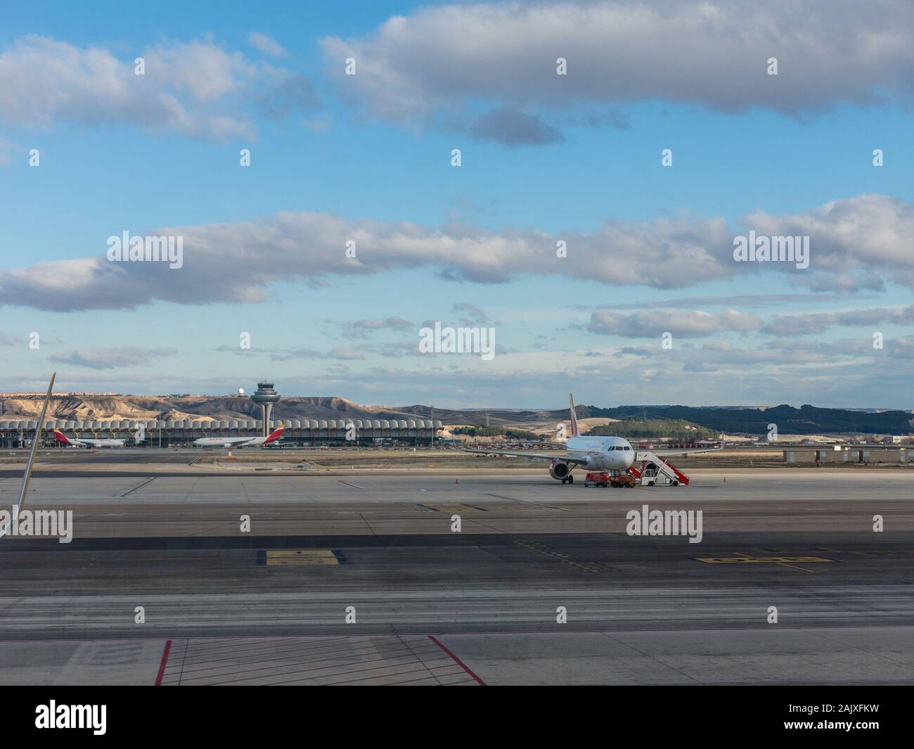 Madrid, Spain - January 27, 2018: A plane prepares to take off on the runway of Terminal T4 the Adolfo Suarez Madrid Barajas Airport. Barajas is the m Stock Photo