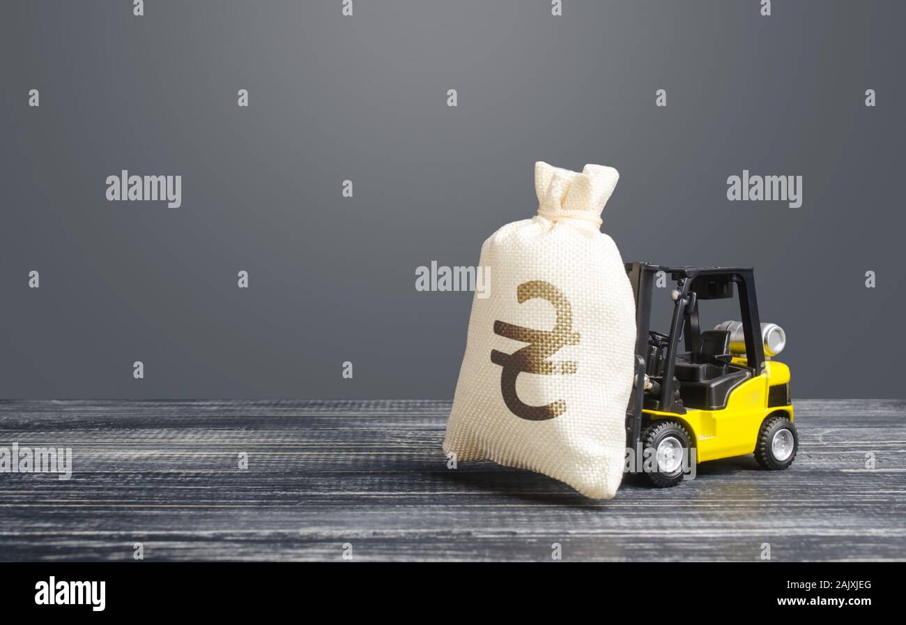 Yellow forklift carries a Ukrainian hryvnia UAH money bag. Big contract, profitable deposit