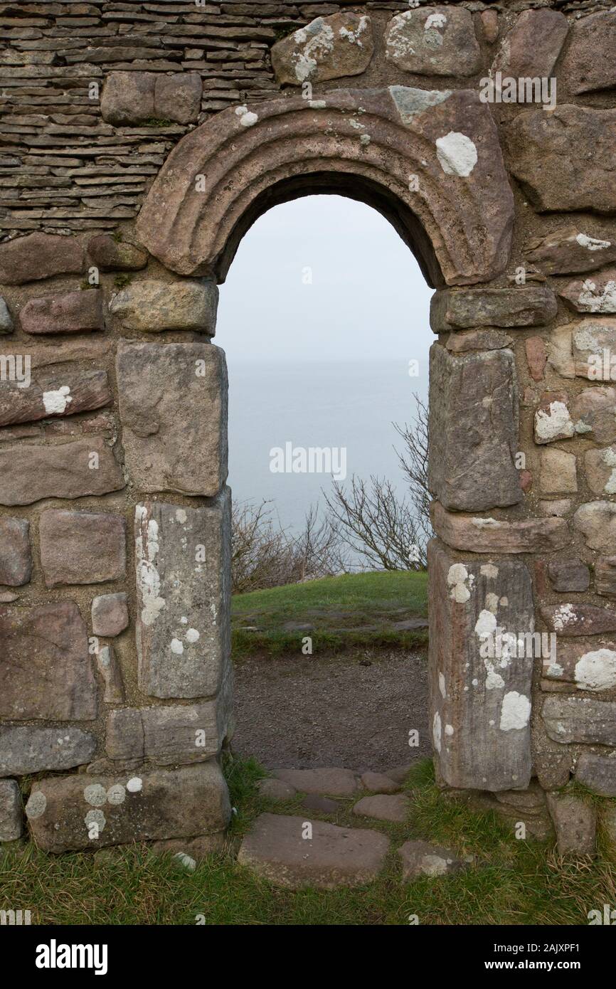 The ruins of St Patrick’s Chapel in winter situated near the vilage of Heysham close to Throbshaw, or Throbshire, Point on the edge of Morecambe Bay. Stock Photo