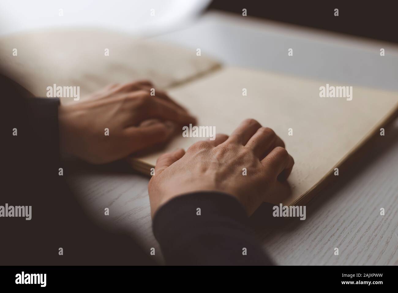Woman's hands read the holy book of the Muslim Koran. Stock Photo