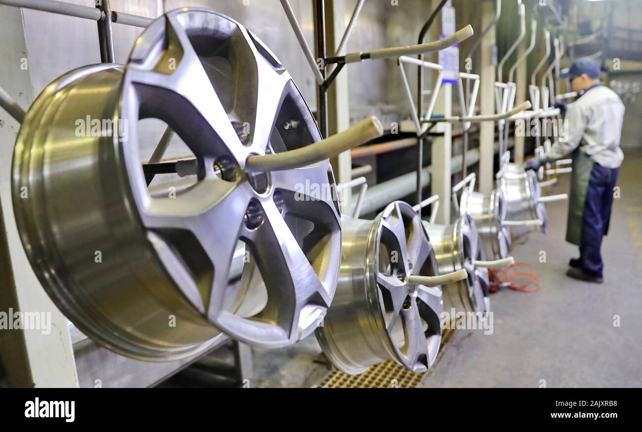 Aluminum car rims are manufactured on the production line at a rim ...