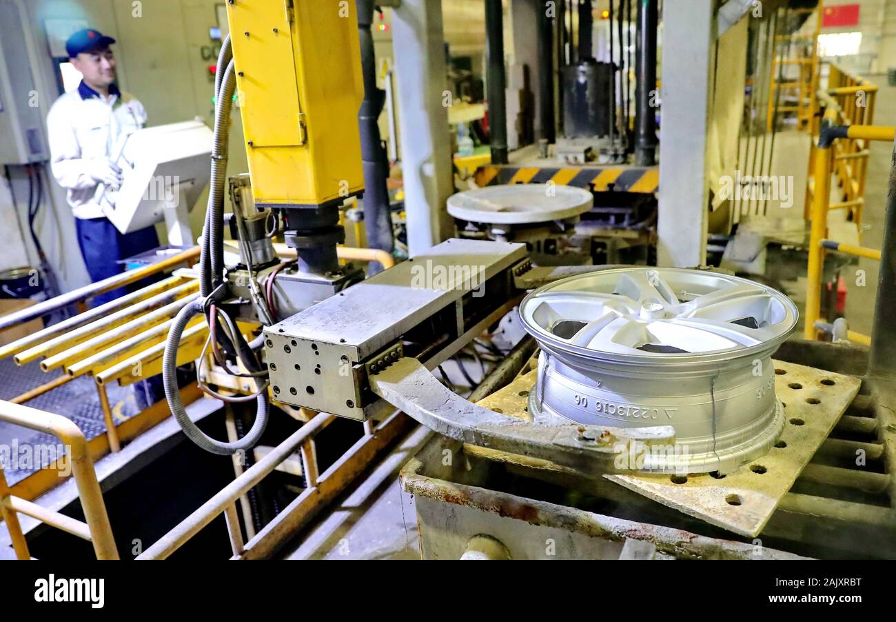 Aluminum car rims are manufactured on the production line at a rim ...