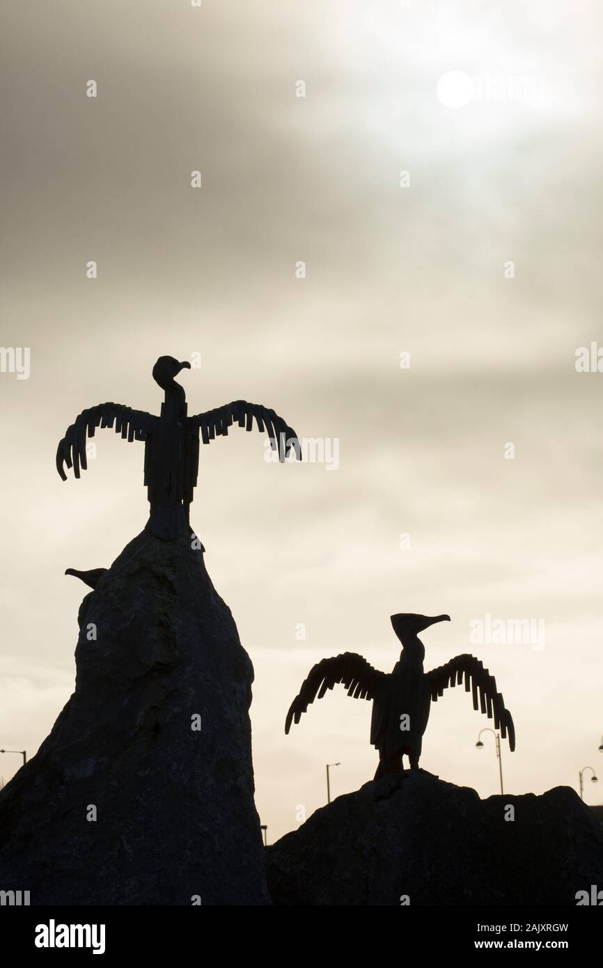 Cormorant sculptures photographed on Christmas day 2019 along the seafront of Morecambe in Lancashire England UK GB. Stock Photo