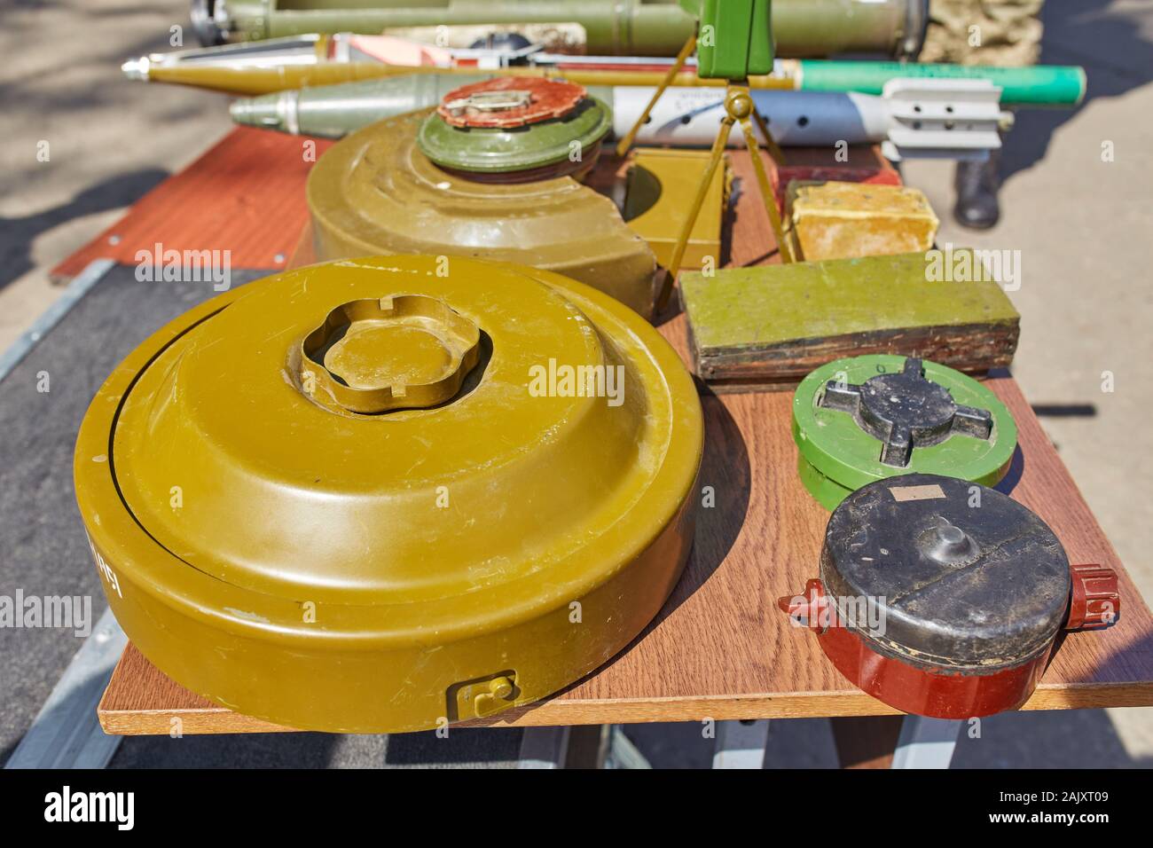 Anti-tank and anti-personnel mines on the stand. Weapons of war in Ukraine Stock Photo