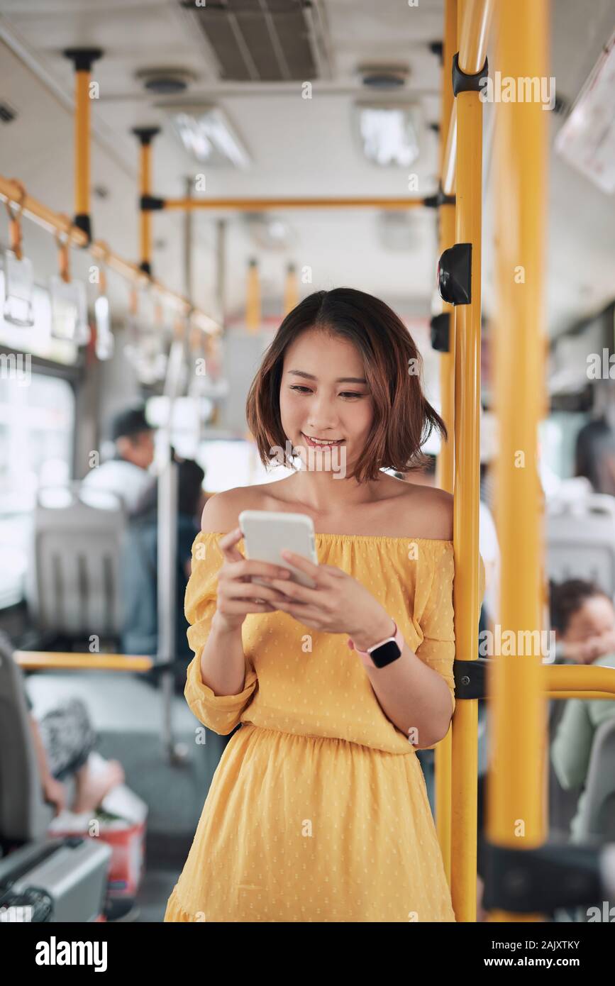 The passenger use smartphone in the bus or train, technology lifestyle, transportation and traveling concept Stock Photo