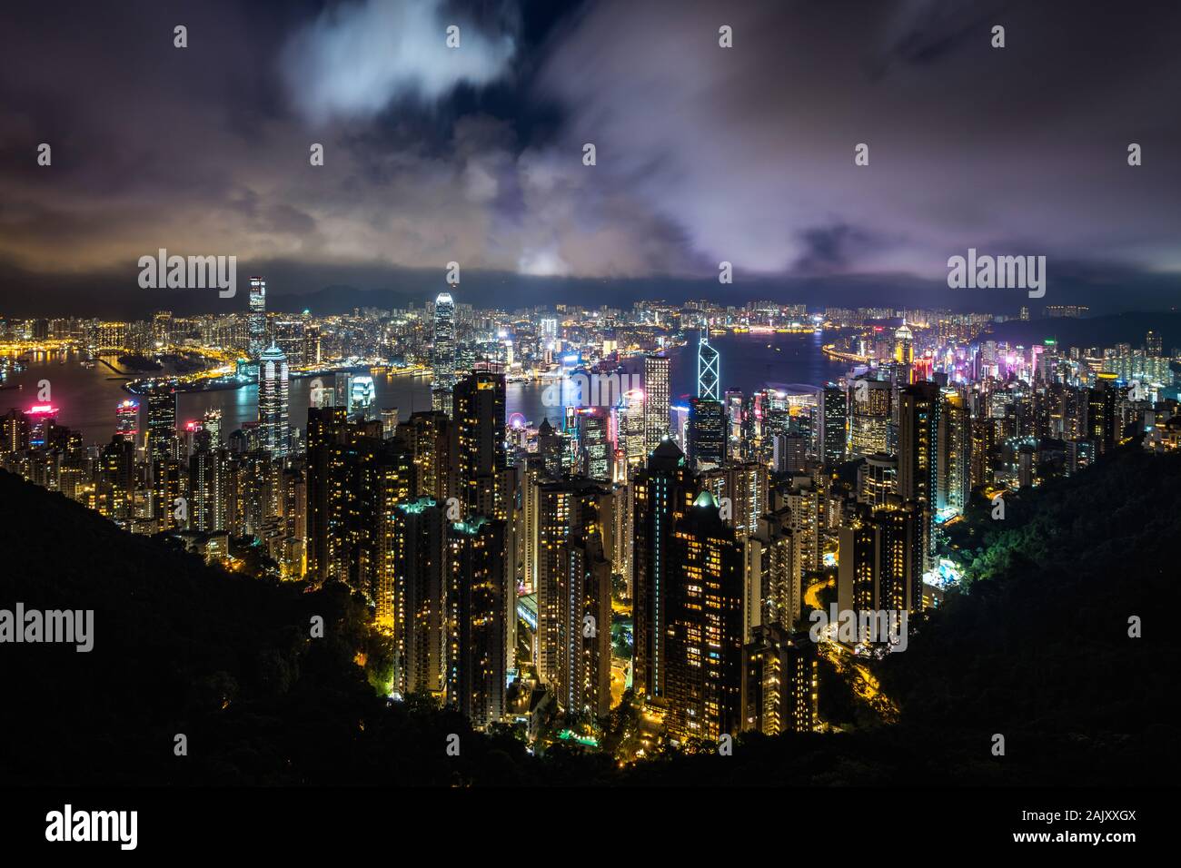 Hong Kong cityscape and Victoria Harbor at night, Hong Kong, China. Stock Photo