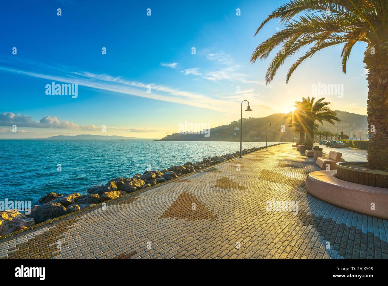 Seafront promenade or esplanade in Porto Santo Stefano at sunrise, Monte  Argentario, Tuscany, Italy Stock Photo - Alamy