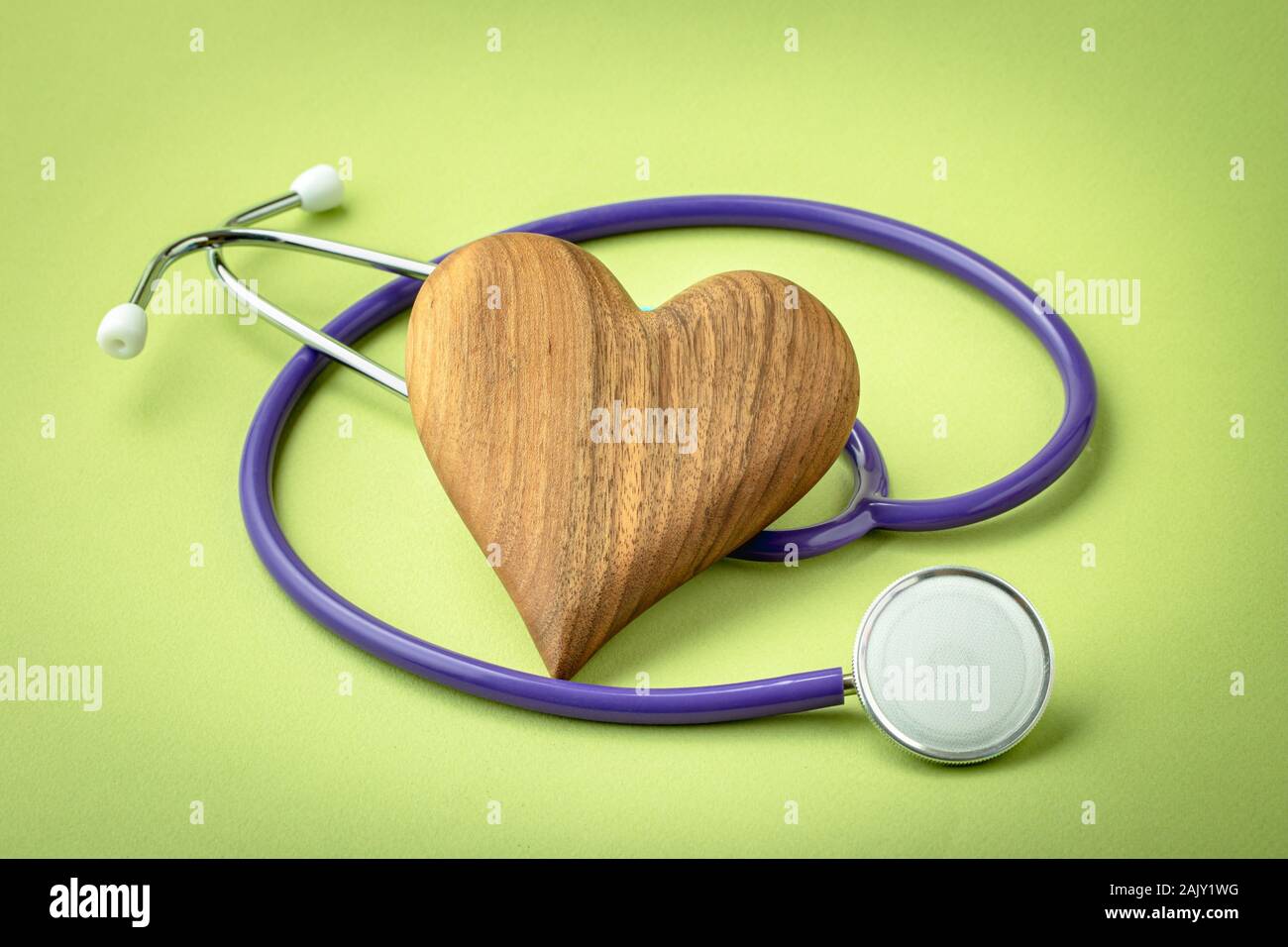 Wooden heart with stethoscope Stock Photo