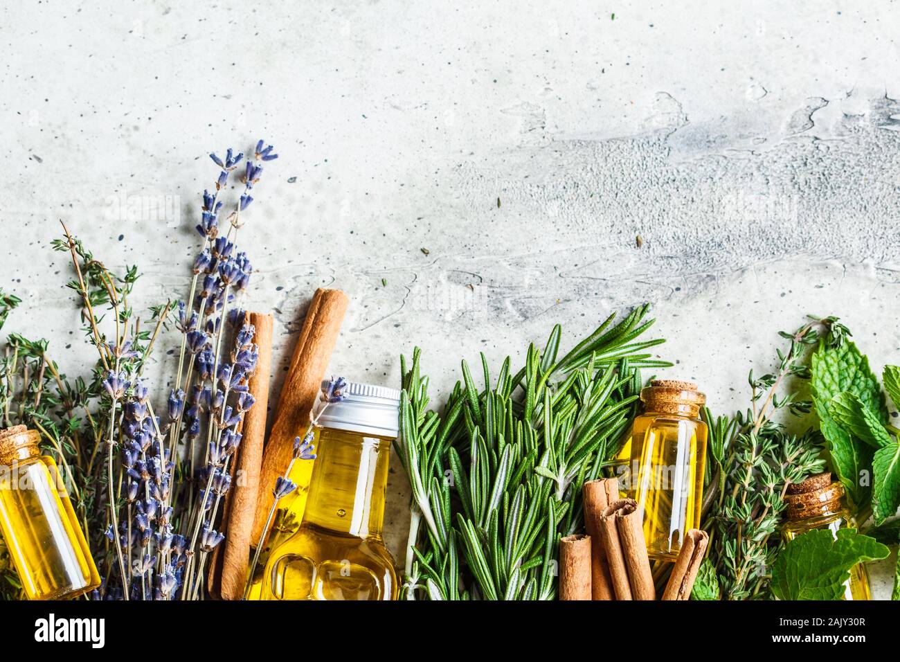 Essential oil in glass bottles. Thyme, mint, rosemary and lavender