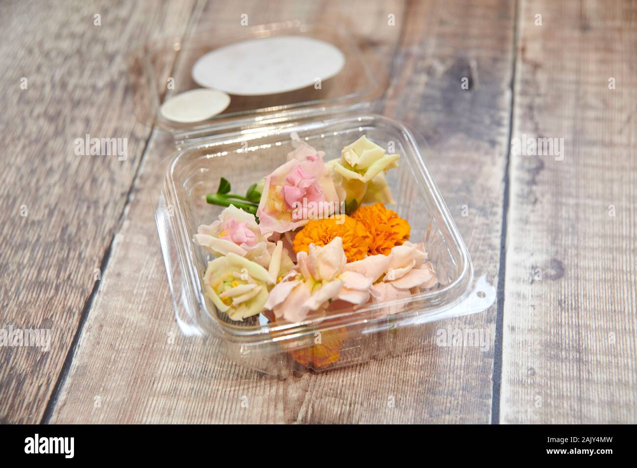 Edible flowers on a wooden kitchen worktop Stock Photo Alamy