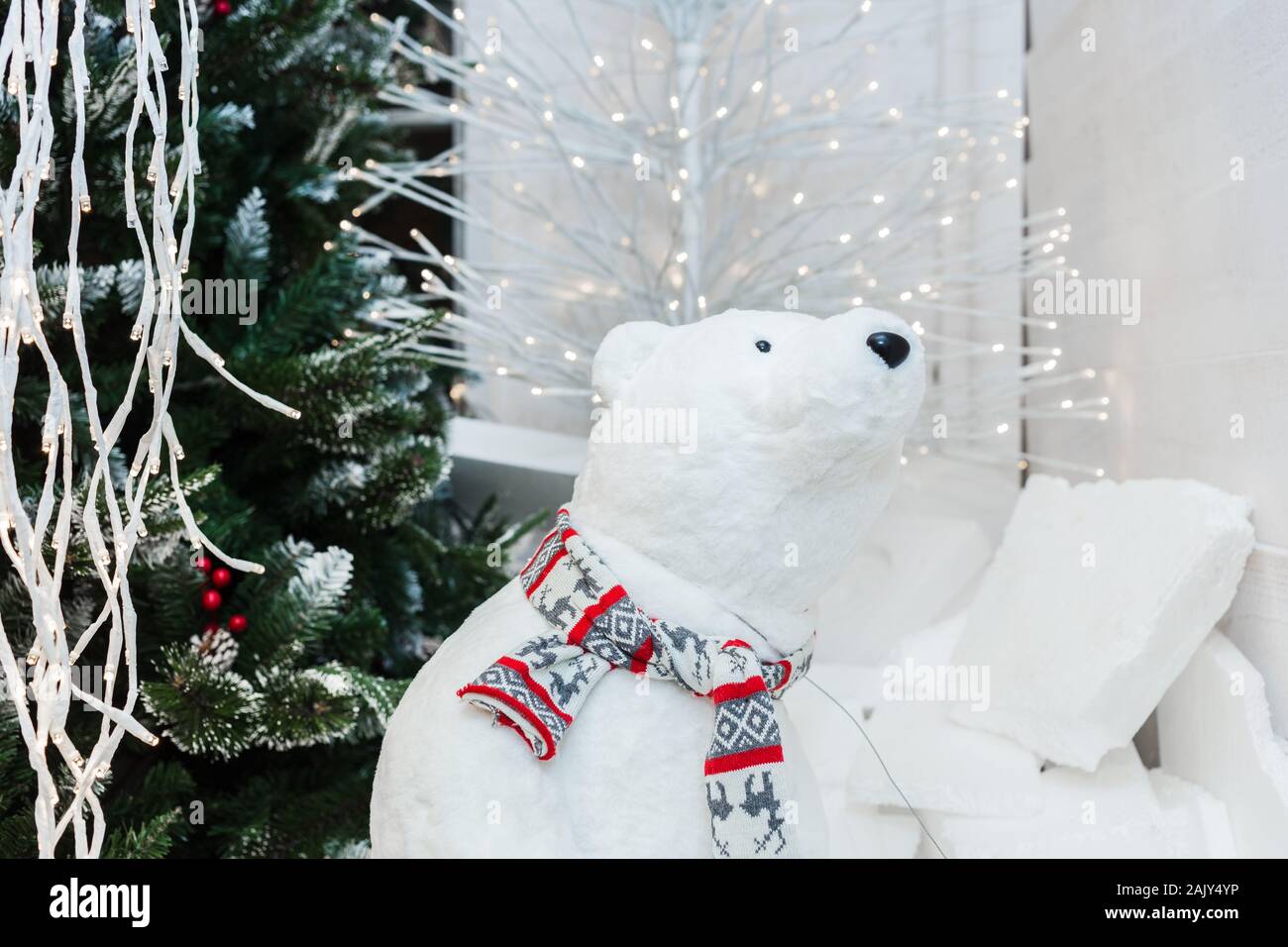 White polar bear doll with snowman in a wooden christmas ...