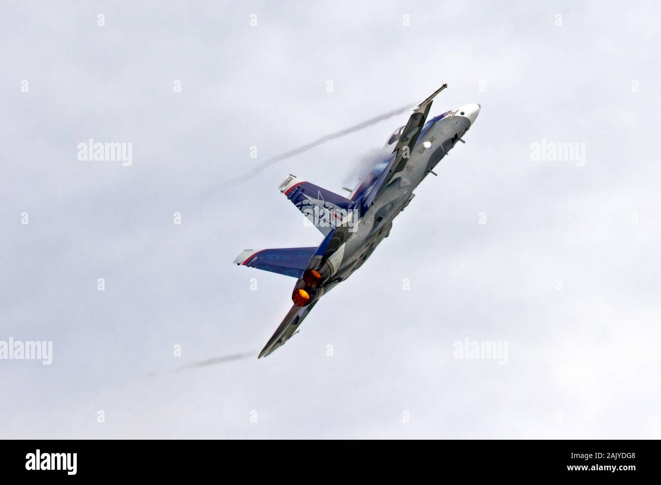 A Canadian Forces McDonnell Douglas CF-18 Hornet Demo team jet as it powers up and away from the spectators at Airshow, London in London, Ontario. Stock Photo