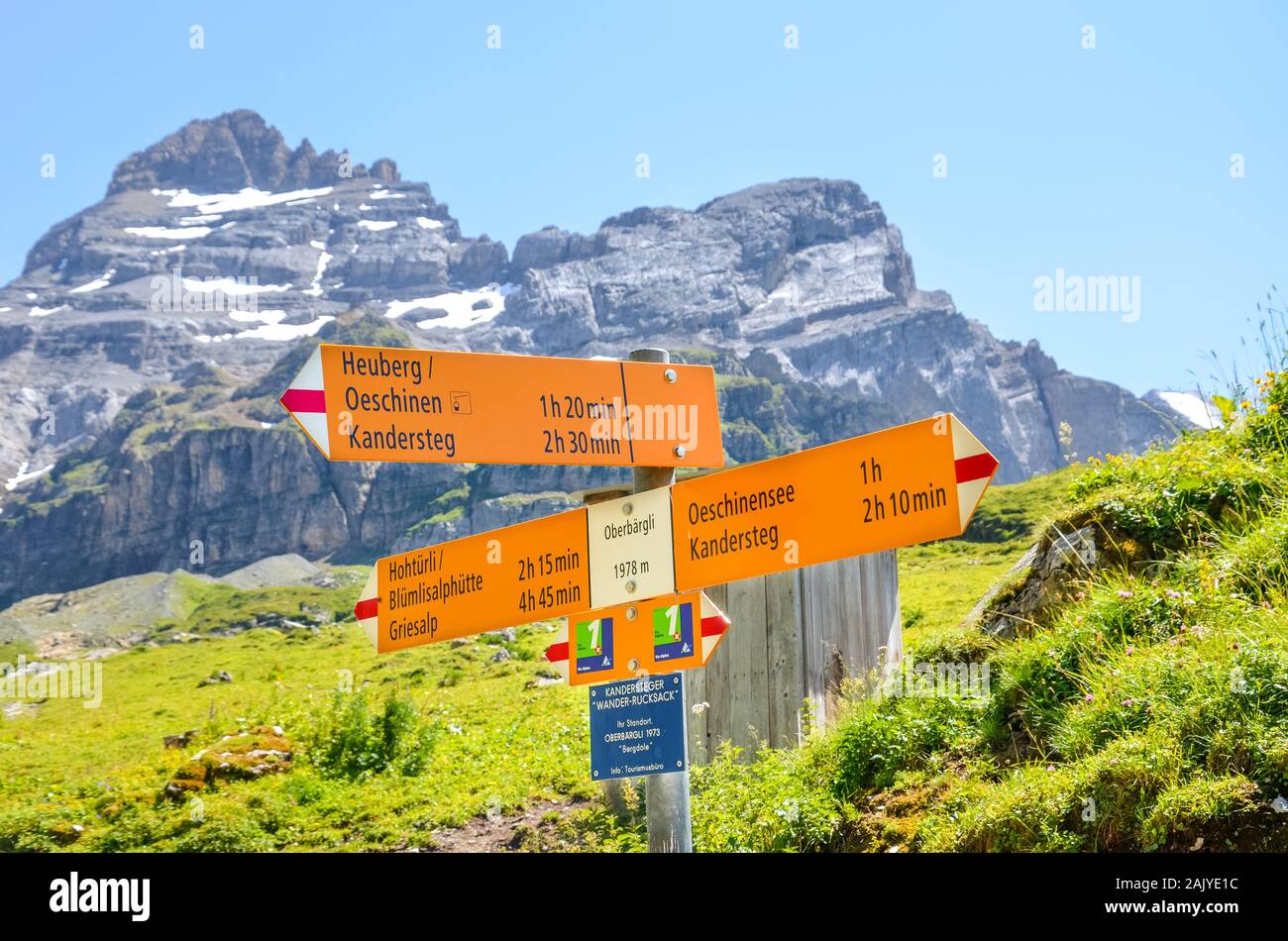 Kandersteg, Switzerland - August 4 2019: Tourist sign in Oberbargli on the  trail to Oeschinensee lake in the Swiss Alps. Information sign giving  directions and walking time. Summer Alpine landscape Stock Photo - Alamy