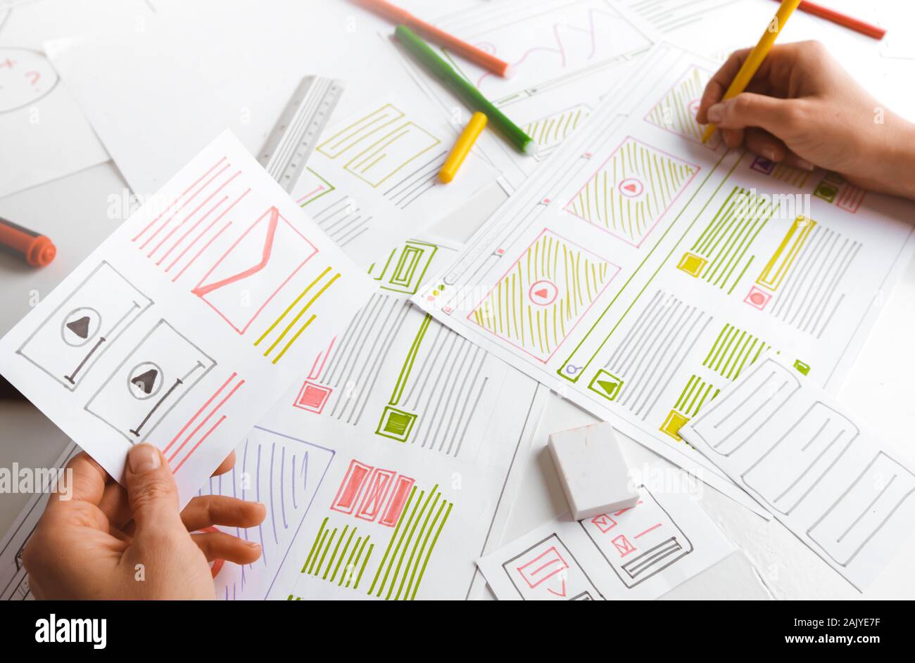 Design and creation of web sites. The designer draws application sketches. Stock Photo
