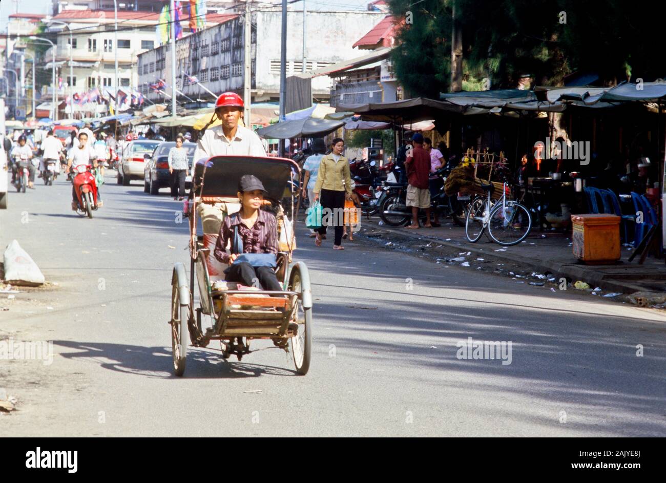 Cyclos are the simpliest way to get around in Pnom Penh Stock Photo