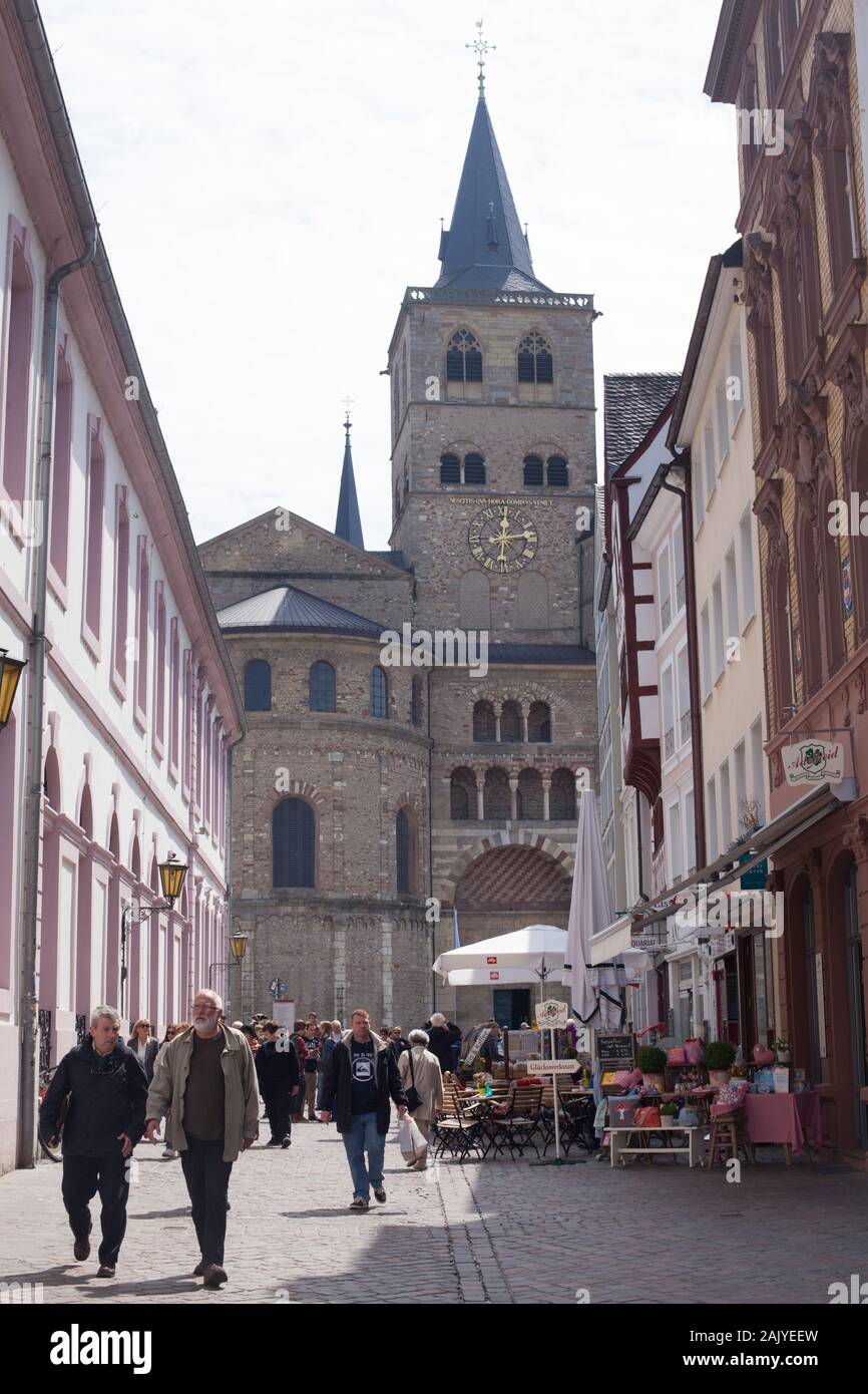 Pedestrian Street View onto the Trierer Dom, the Romanesque Cathedral in the City of Trier, Rhineland-Palatinate, Germany Stock Photo