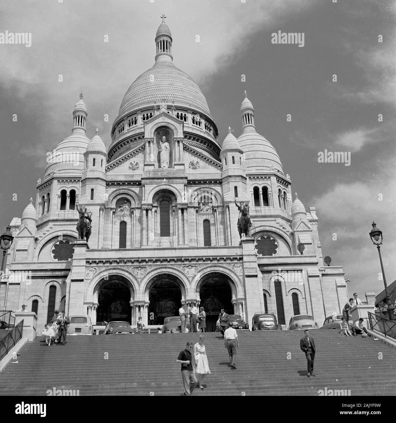 1950s, historical, Sacre-Coeur, Paris, France, a domed roman catholic church, consecrated in 1919 and one of the most inconic monuments in the French city which sits on a hilly peak in Montmartre. Stock Photo