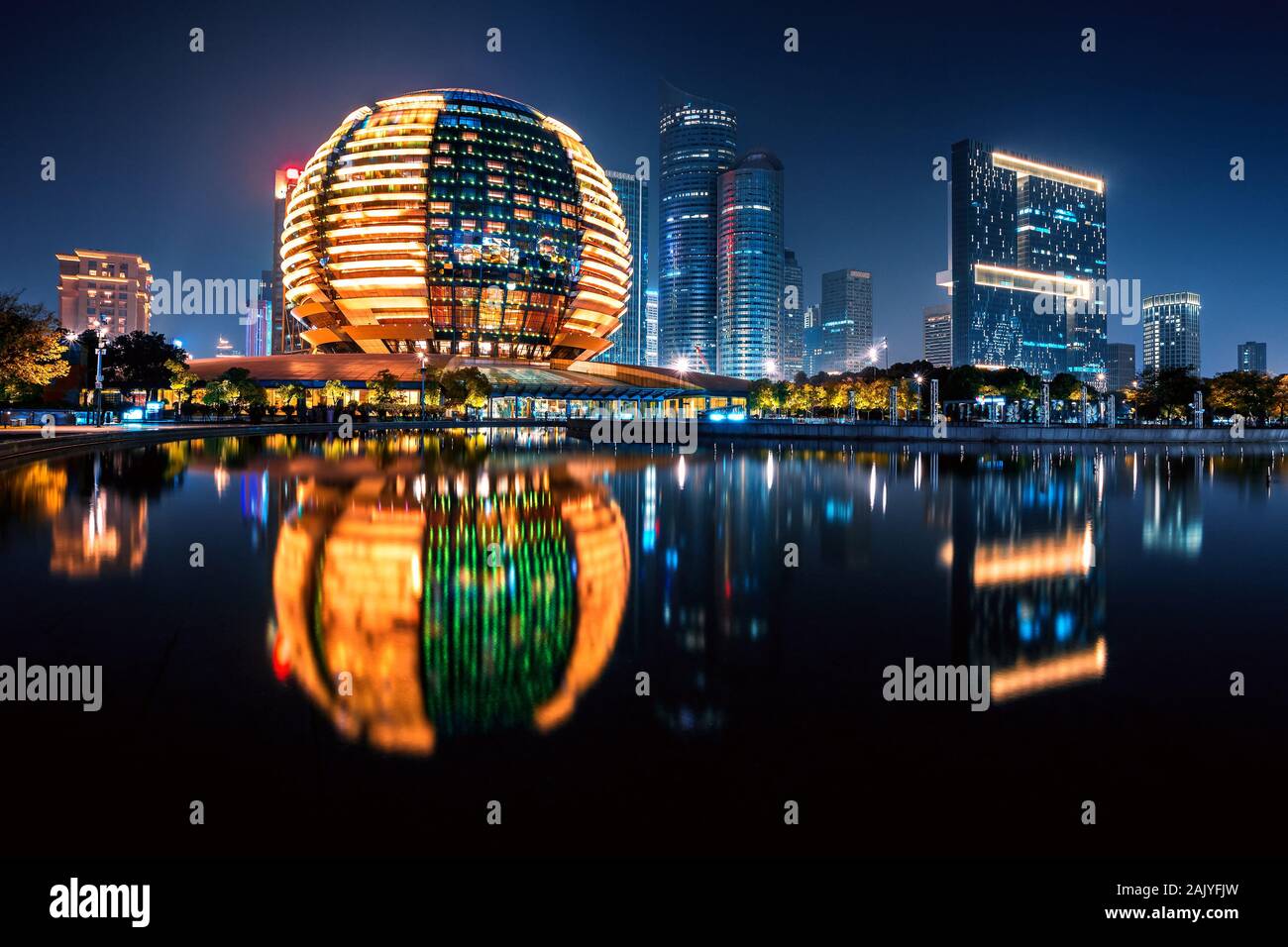 Night view of Qianjiang New Town with reflection, Hangzhou, Zhejiang, China Stock Photo