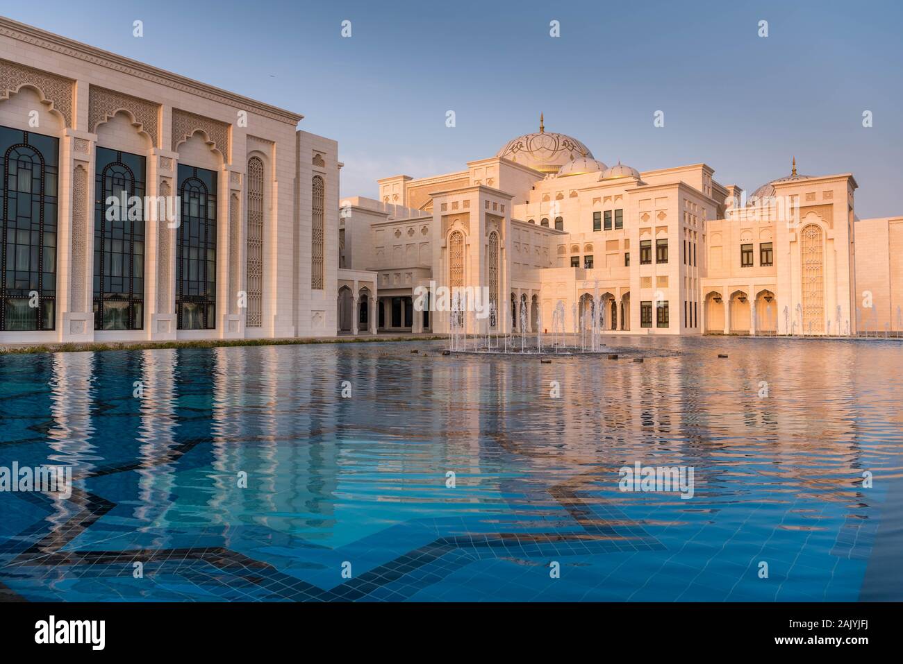 Abu Dhabi: Qasr Al Watan (Palace of the Nation), Presidential Palace in Abu Dhabi, outdoor, exterior, at sunset, reflection in water, nobody Stock Photo