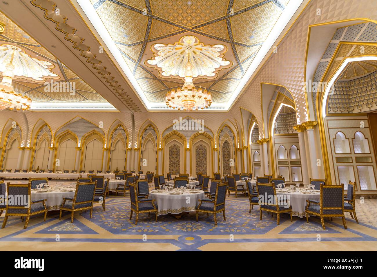 Abu Dhabi, United Arab Emirates: Sumptuous interiors of Presidential Palace (Qasr Al Watan) dining room, round tables and chairs, Palace of the Nation Stock Photo