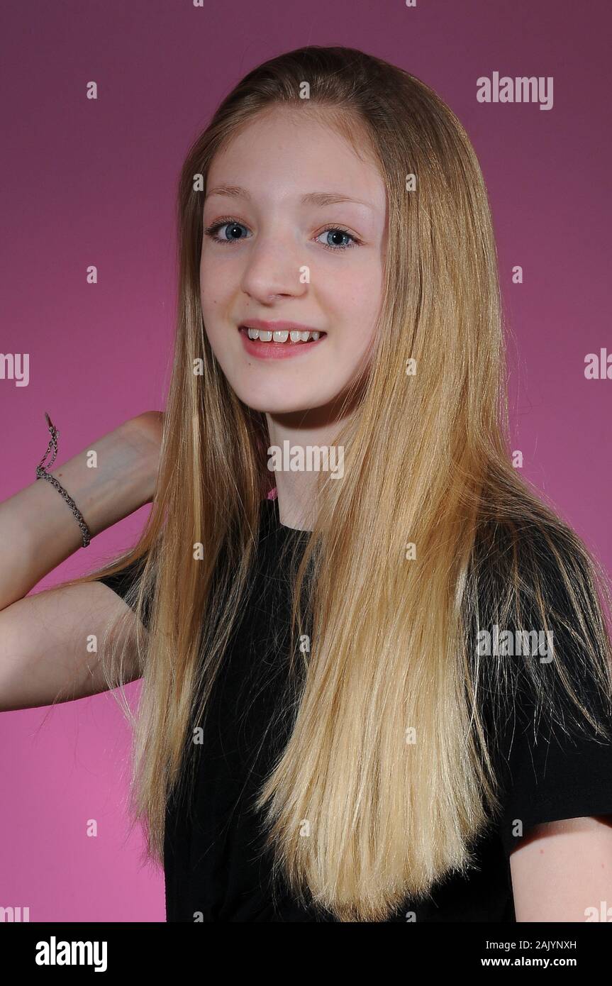 Pretty Blonde Haired Caucasian Teenage Girl In A Black T Shirt